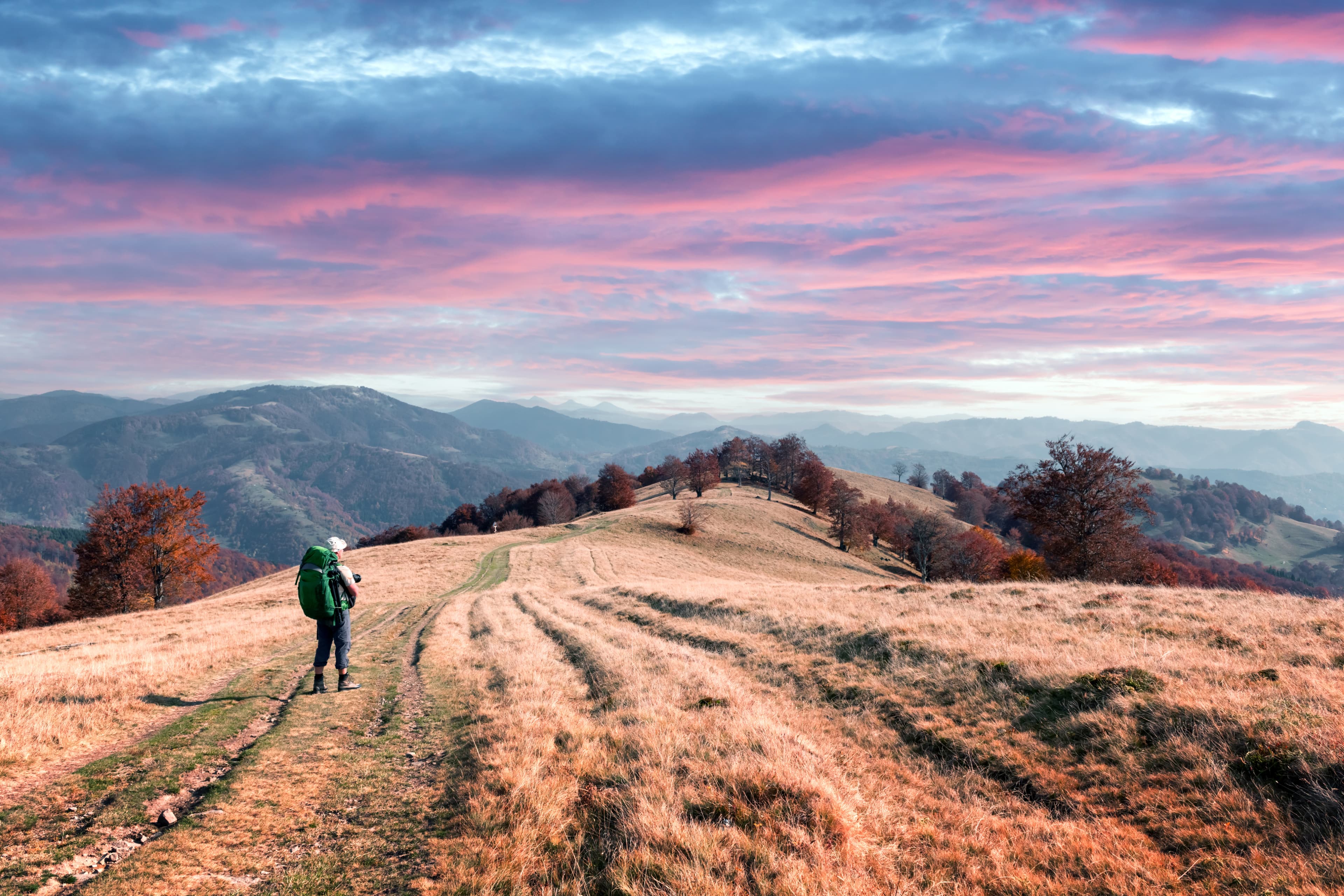 Hikers on a sunset ridge